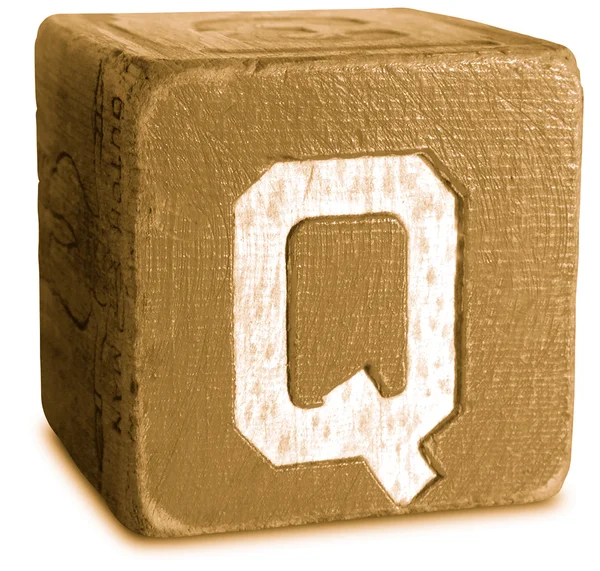 セピア色の木製のブロック文字 q の写真 — ストック写真
