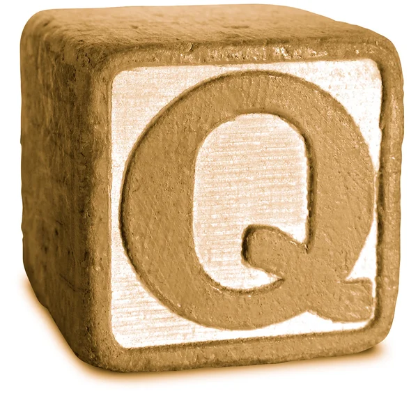セピア色の木製のブロック文字 q の写真 — ストック写真