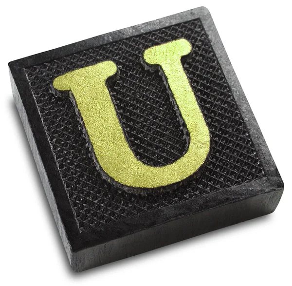 Фотография буквы U в игровой плитке — стоковое фото