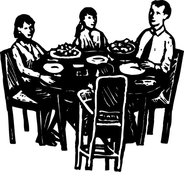 Семейный ужин за обеденным столом
