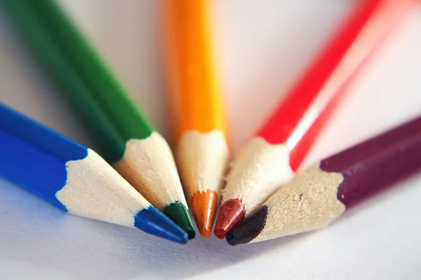 Crayons on paper board — Stock Photo, Image