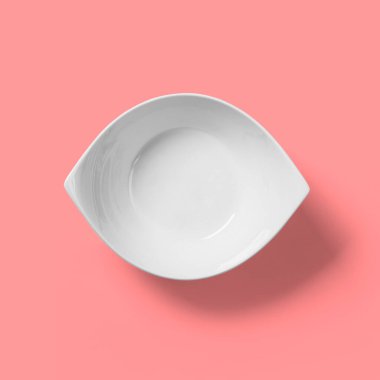 Pembe arka planda izole edilmiş boş beyaz kase.