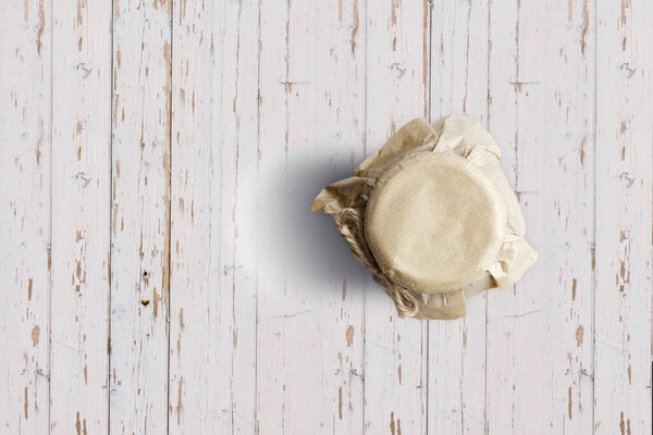 Top up up view blueberry jam jar isolated on white wooden background. suitable for your design project.