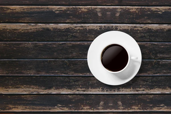 Beyaz çay fincanı ahşap zemin üzerinde.