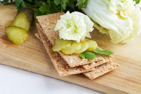 Rye crisp bread with cabbage and pickle