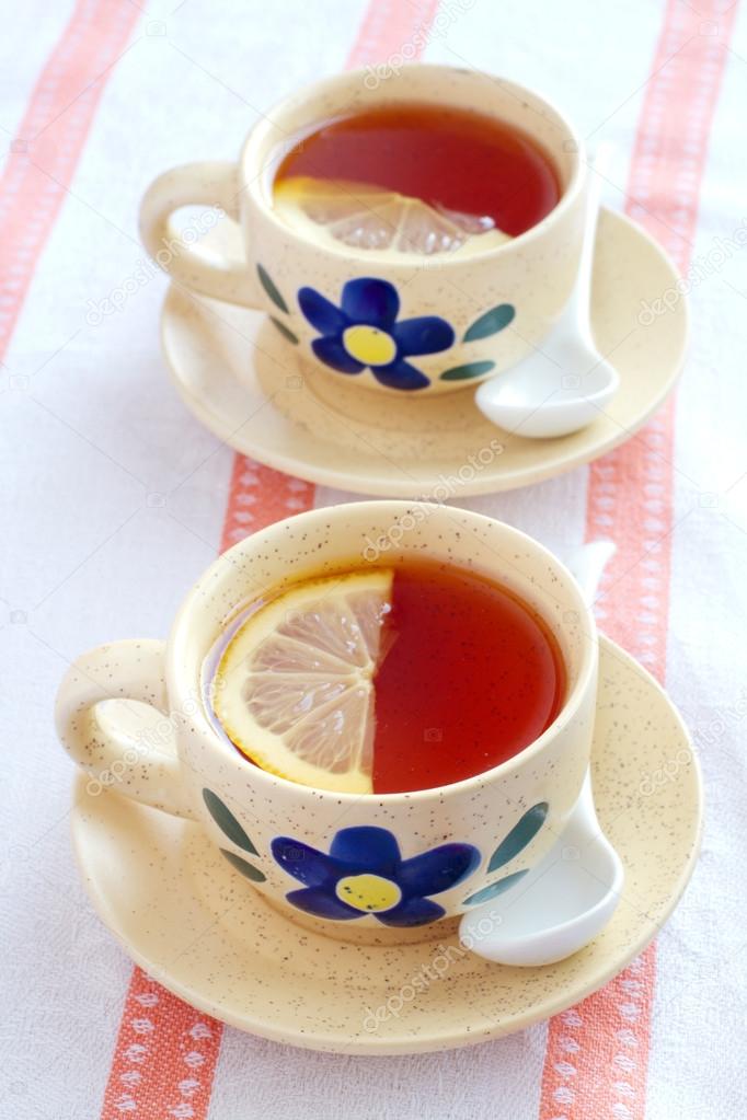 Two cups of black tea with lemon — Stock Photo © marishu #28632757