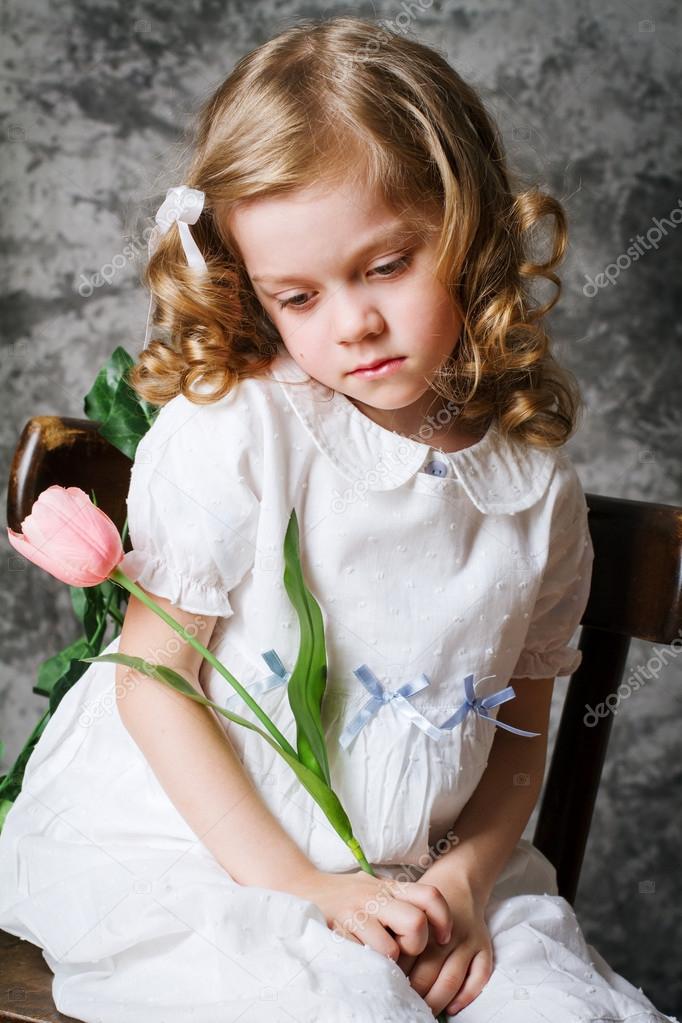portrait of curly girl with tulips