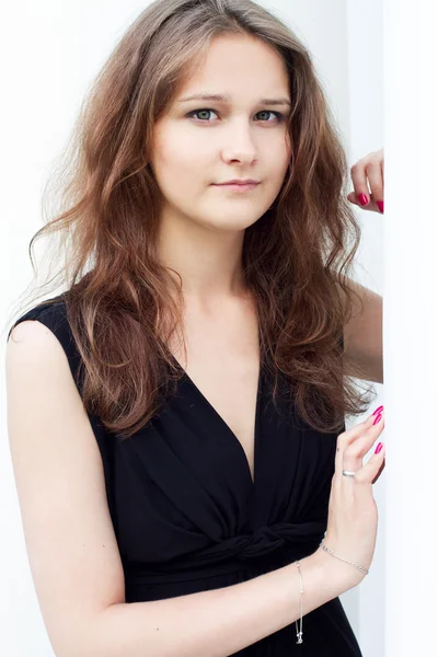 Young woman in a long black dress — Stock Photo, Image