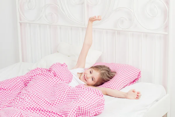 Young girl wakes up in the morning — Stock Photo, Image