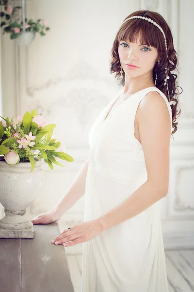 Portrait of a young woman in white dress — Stock Photo, Image