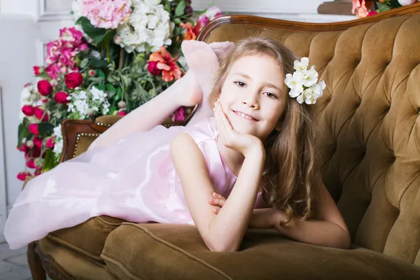 Little girl lying on the couch — Stock Photo, Image