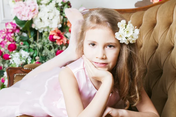 Little girl lying on the couch — Stock Photo, Image