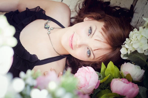 Young woman lying on a floor — Stock Photo, Image