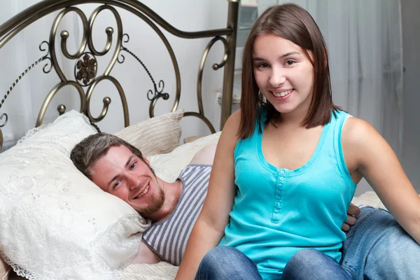 Loving couple relaxing on bed — Stock Photo, Image