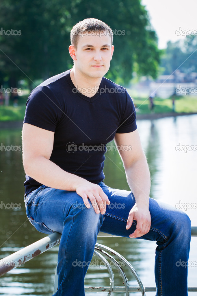 portrait of a young man in the park 