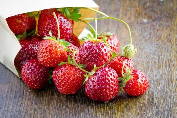 Fresh strawberries in a paper bag — Stock Photo, Image