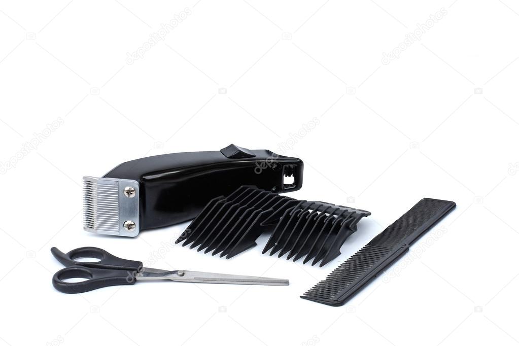 hair clipper, comb and scissors on white background