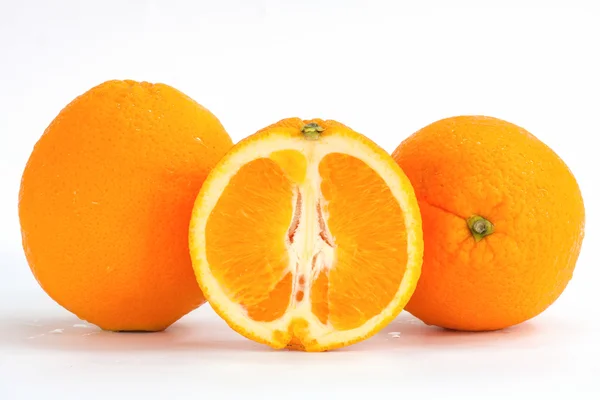 Sliced orange fruit segments isolated on white background — Stock Photo, Image