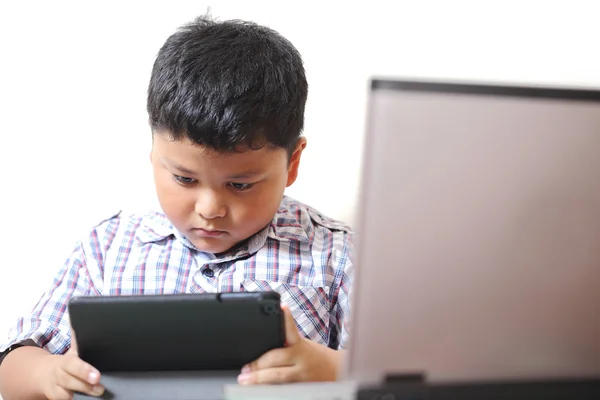 Asian boy playing tablet fun. — Stock Photo, Image