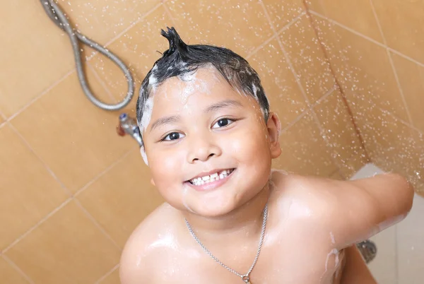 Asian boy taking a bath — Stock Photo, Image