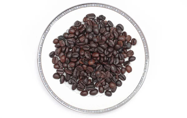 Coffee beans in a glass on a white background. — Stock Photo, Image