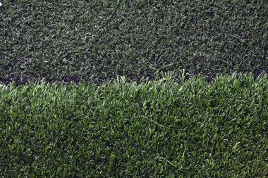 Grass football field with gravel. clipart