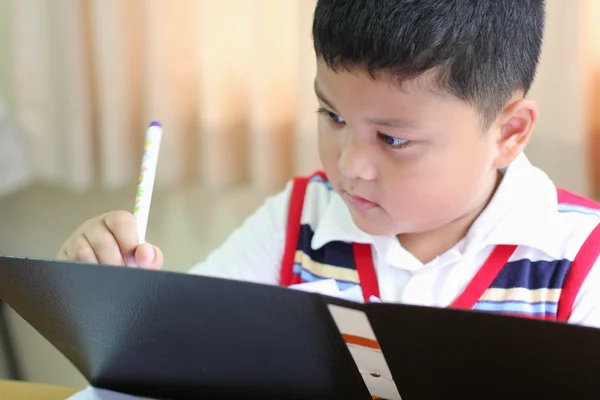 The boy intently to checking documents — Stock Photo, Image