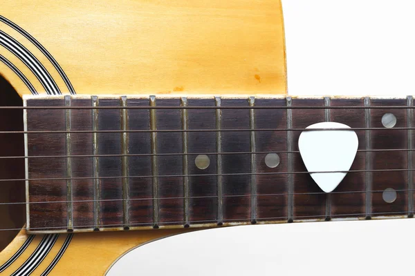 Guitar plectrum on guitar — Stock Photo, Image