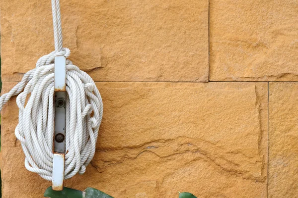 Nylon rope tied to the wall — Stock Photo, Image