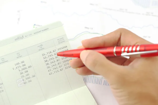 Account book report with hand of someone — Stock Photo, Image