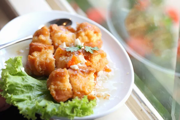 Chicken Fritter topped with sauce — Stock Photo, Image