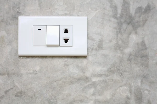 Світловий вимикач на стіні цемент — стокове фото