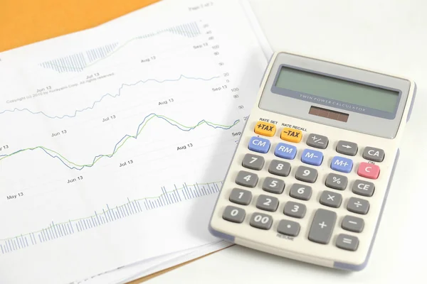 Finance statement with calculator — Stock Photo, Image
