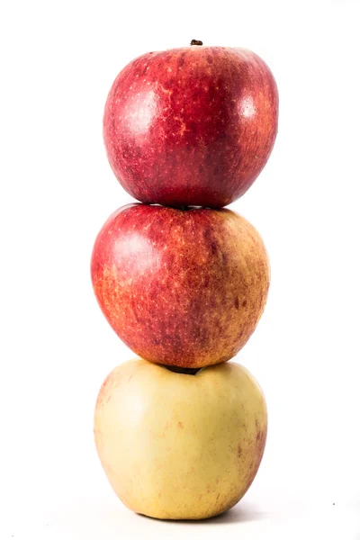 Tres manzanas sobre fondo blanco Imagen de archivo