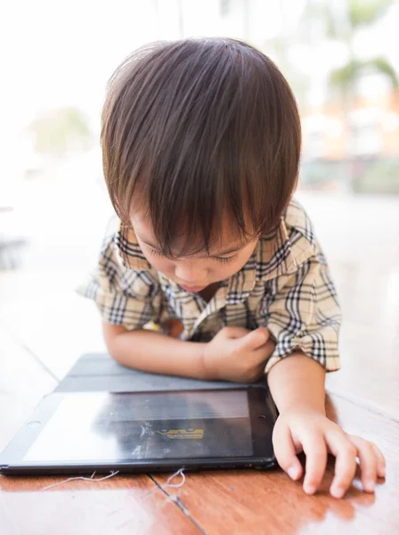 Asian boy play tablet fun — Stock Photo, Image