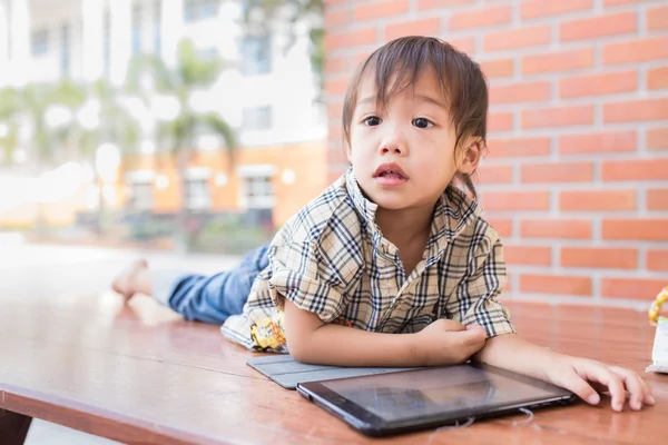 Asian boy play tablet fun — Stock Photo, Image