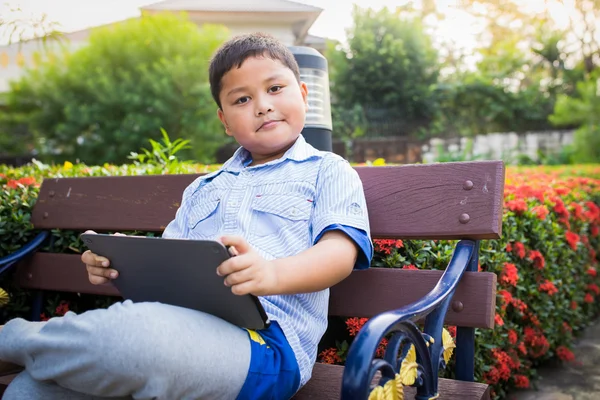 Asian boy playing Tablet fun — Stock Photo, Image