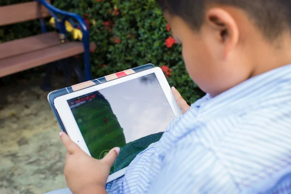 Asian boy playing Tablet fun — Stock Photo, Image