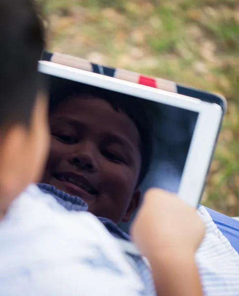 Asian boy playing Tablet fun — Stock Photo, Image