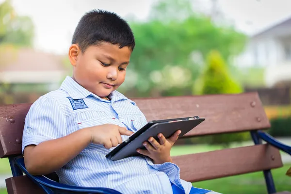 Asian boy playing Tablet fun — Stock Photo, Image