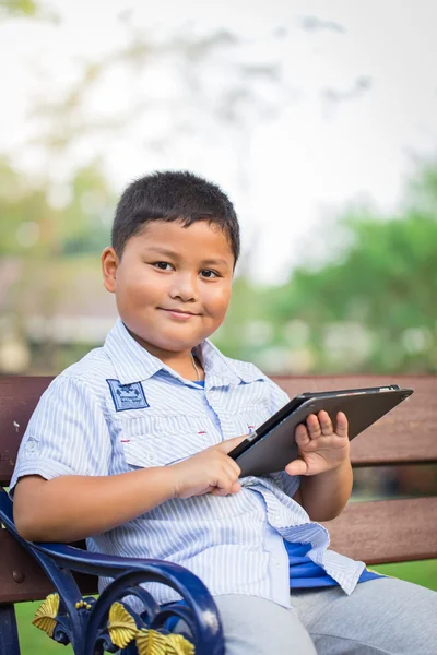 Asian boy playing Tablet fun — Stock Photo, Image