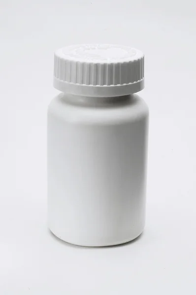 Botella de píldoras de plástico blanco de closeed — Foto de Stock