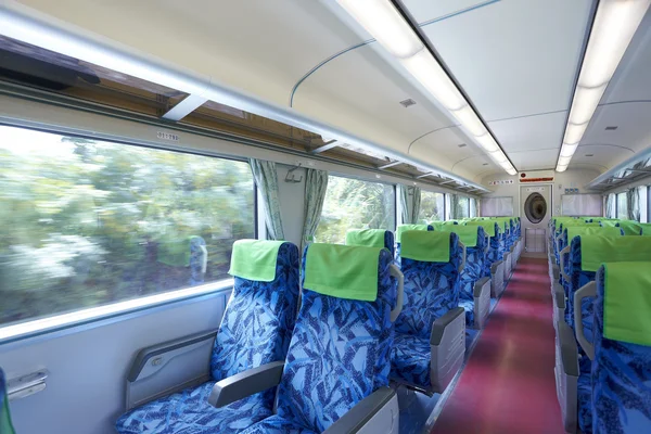 Empty train car inside view of a running train — Stock Photo, Image