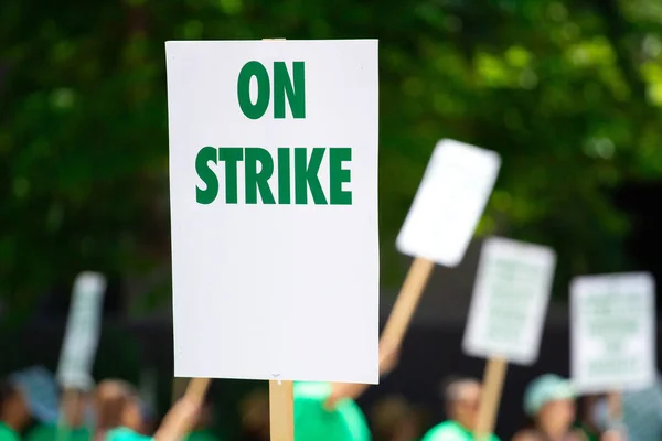 People Rallying Carrying Strike Signage — Stock Photo, Image