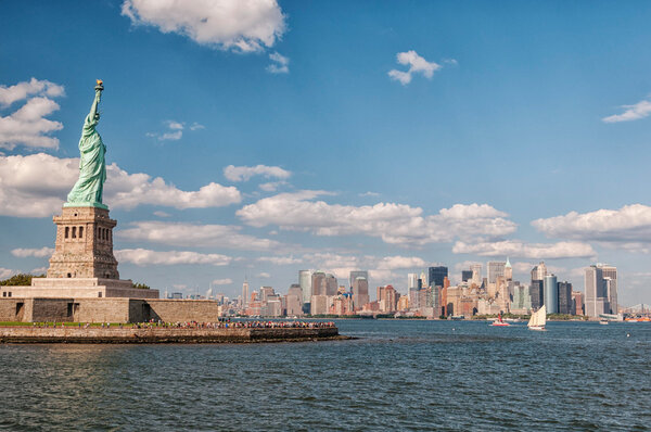 Panoramic view of Statue of Liberty and Manhattan.