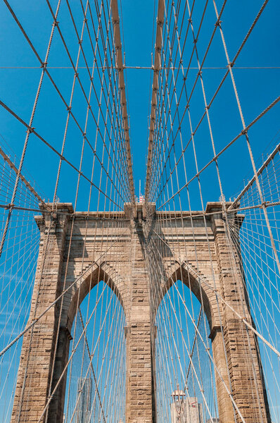 Upward view of Brooklyn Bridge.