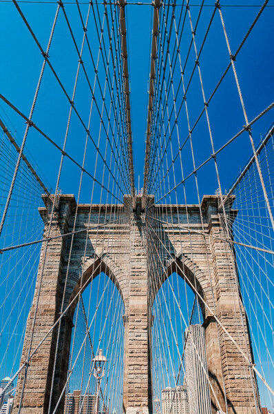 Upward view of Brooklyn Bridge.