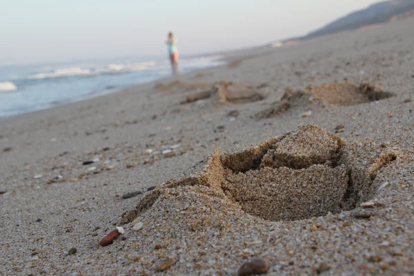 bir kişinin bir plajda ıslak kum Footprints