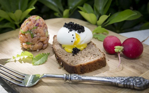 Eggs Trinity - Poached Egg, Caviar, Raddish — Stock Photo, Image