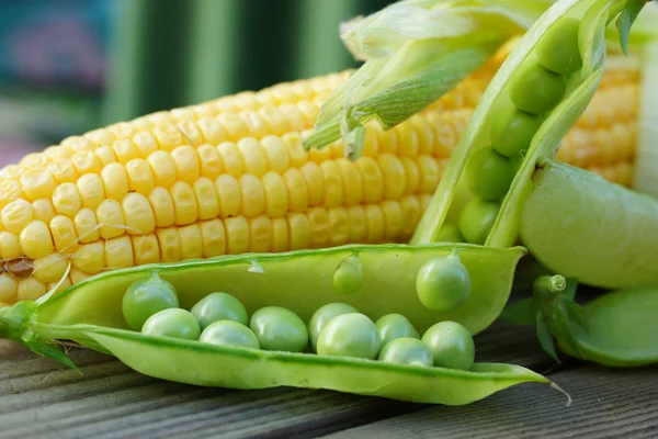 Pods of peas and corn — Stock Photo, Image